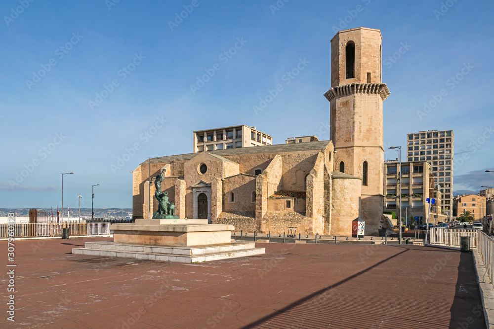 Church of Saint-Laurent and the bronze statue Le Dresseur d’Oursons in Marseille, France