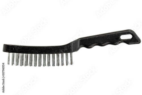 Steel wire brush with handle from black plastic for cleaning and polishing hard or metal equipment, isolated on white background
