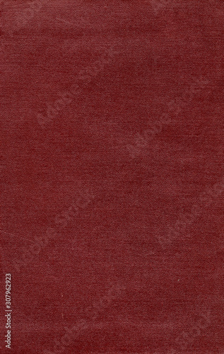 Artificial leather texture. Red old book cover. Rough surface with embossed. Blank retro page. Empty place for text. Perfect for background and vintage style design.