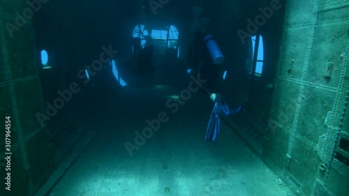 Underwater footage of scuba divers exploring a sunken plane in the Red Sea near Aqaba, Jordan. photo