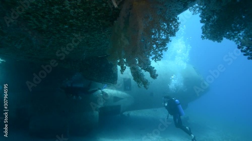 Underwater footage of scuba divers exploring a sunken plane in the Red Sea near Aqaba, Jordan. photo