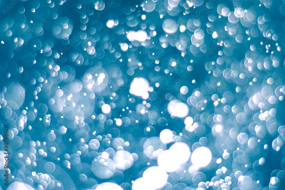 Abstract bokeh lights with light Blue background, beautiful bokeh from water droplets