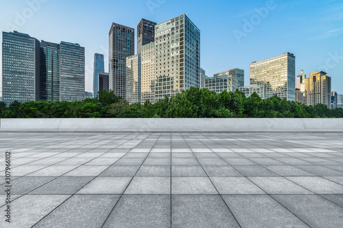 Empty city square road and modern business district office buildings in Beijing, China