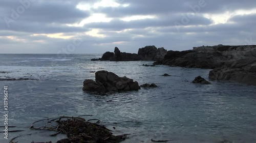 Rugged volcanic rocky shore in San Cristobal (or Chatham Island), the easternmost island in the Galapagos Archipelago, 2019 photo