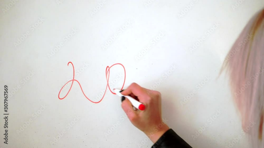 Writing with a red marker on a whiteboard, the actual year of 2020. Writing with a red marker on a whiteboard, the actual year of 2020.