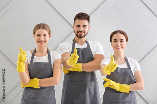 Team of janitors showing th...