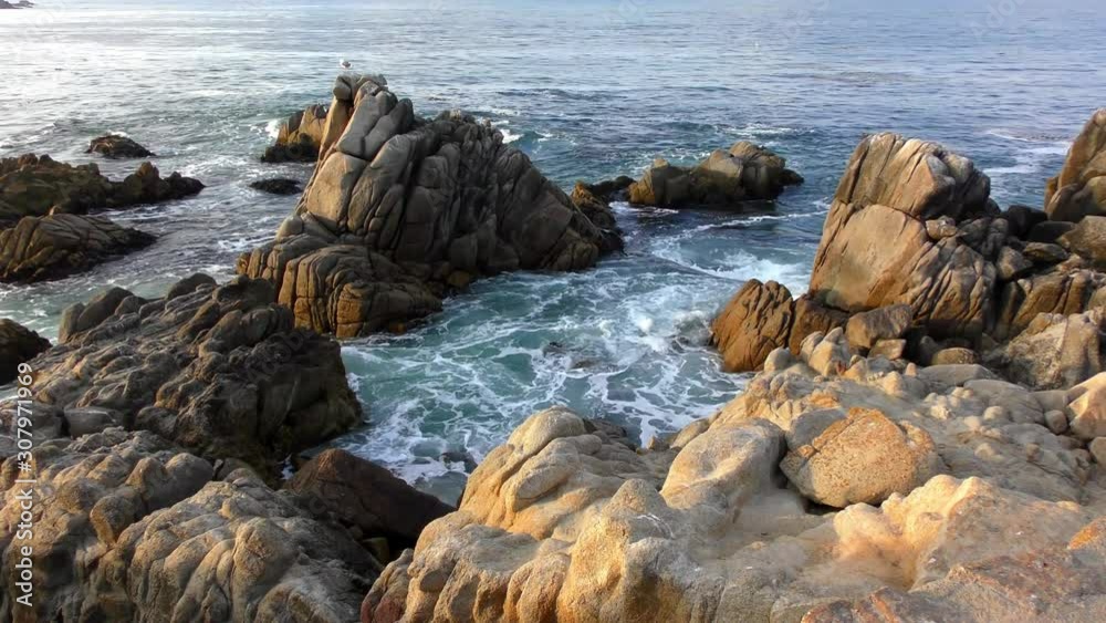 Rugged volcanic rocky shore in San Cristobal (or Chatham Island), the easternmost island in the Galapagos Archipelago, 2019 Rugged volcanic rocky shore in San Cristobal (or Chatham Island), the easternmost island in the Galapagos Archipelago, 2019