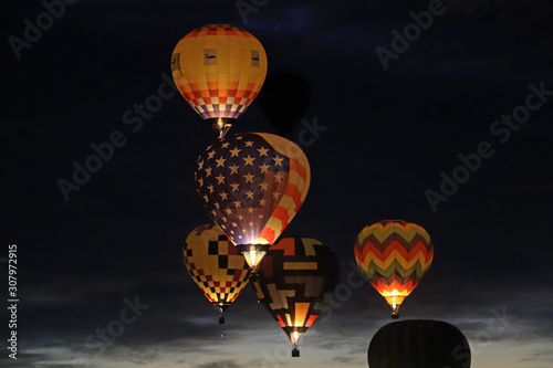 Illuminated hot air balloons at night