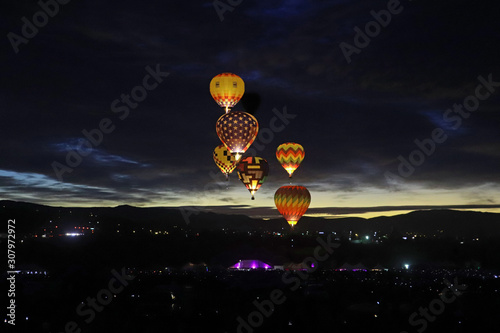 Illuminated hot air balloons at night