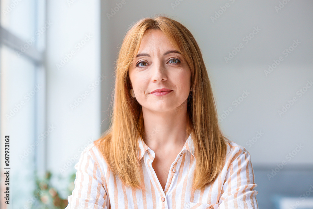 Portrait of beautiful mature woman in office Portrait of beautiful mature woman in office