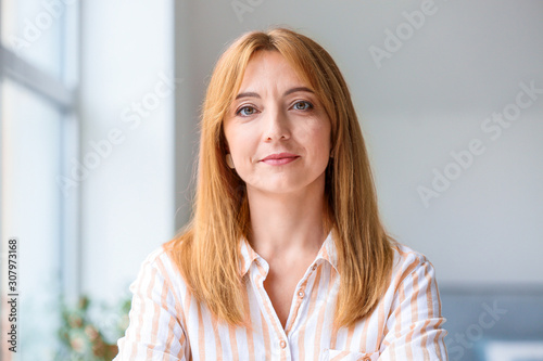 Portrait of beautiful mature woman in office