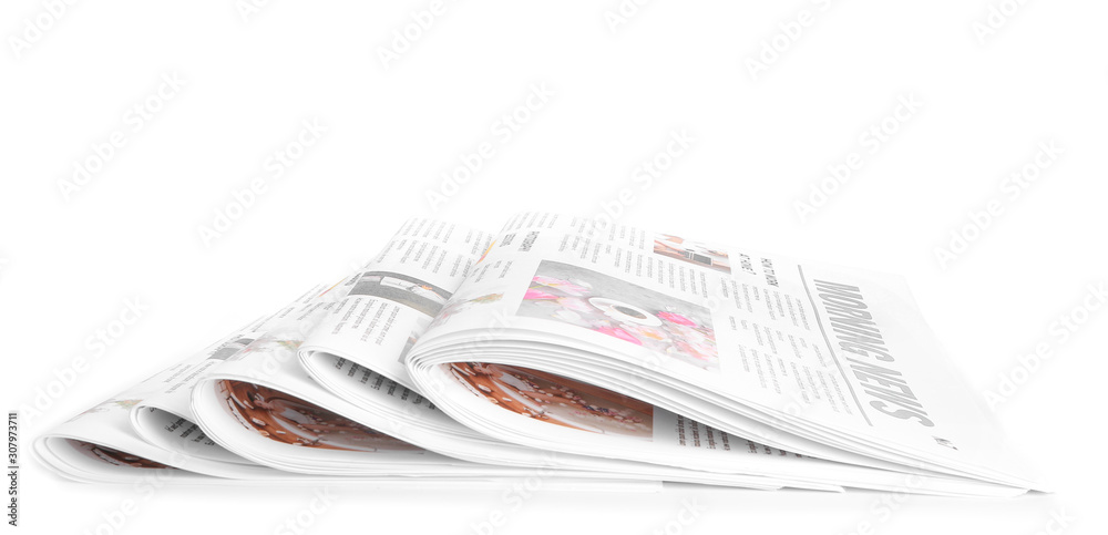 Many newspapers on table against white background Many newspapers on table against white background