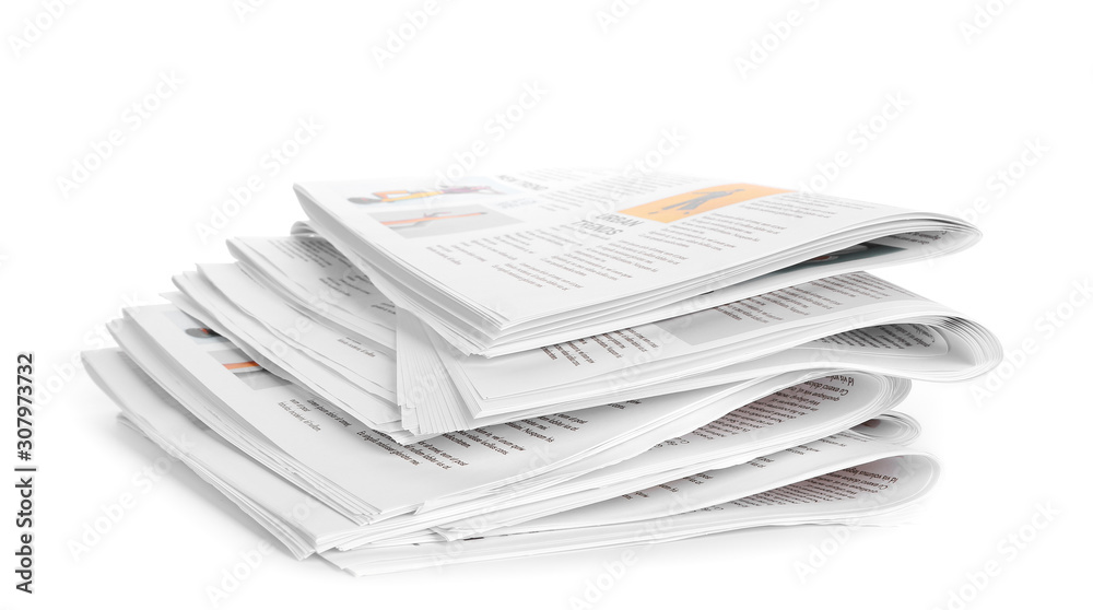 Many newspapers on table against white background Many newspapers on table against white background
