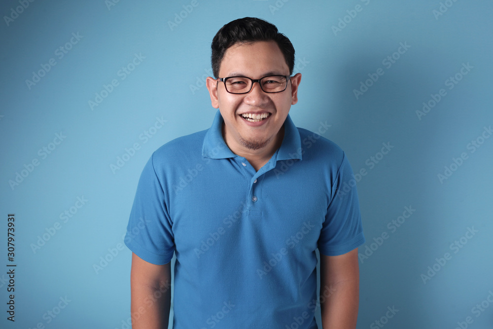 Fototapeta premium Young Asian Man Smiling Happily