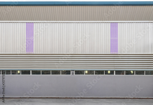Metal sheet building wall siding with purple transparent roof sheet, background texture.