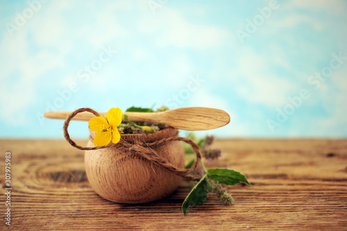 traditional medicine recipes, field herbs in wooden containers, the concept of natural medicines