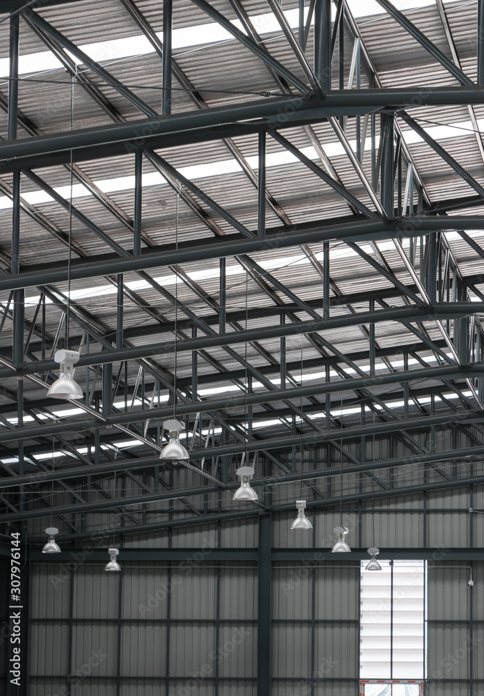 Warehouse metal roofing, Large steel roof structure, bottom view with skylight translucent roof. Warehouse metal roofing, Large steel roof structure, bottom view with skylight translucent roof.