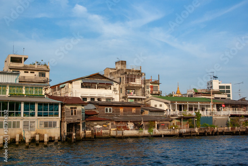 Buildings on bank of Chao Phraya River in Bangkok, Thailand