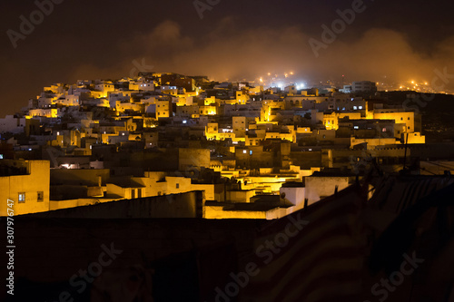 Night view of the Tetouan Medina quarter in Northern Morocco. A medina is typically walled, with many narrow and maze-like streets.