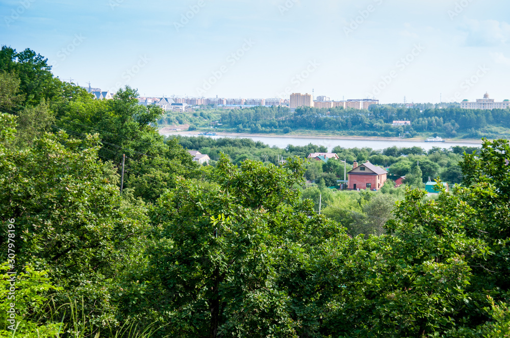 Russia, Blagoveshchensk, July 2019: View of the Amur river in the summer, on both banks of the city of Blagoveshchensk and the city of Heihe