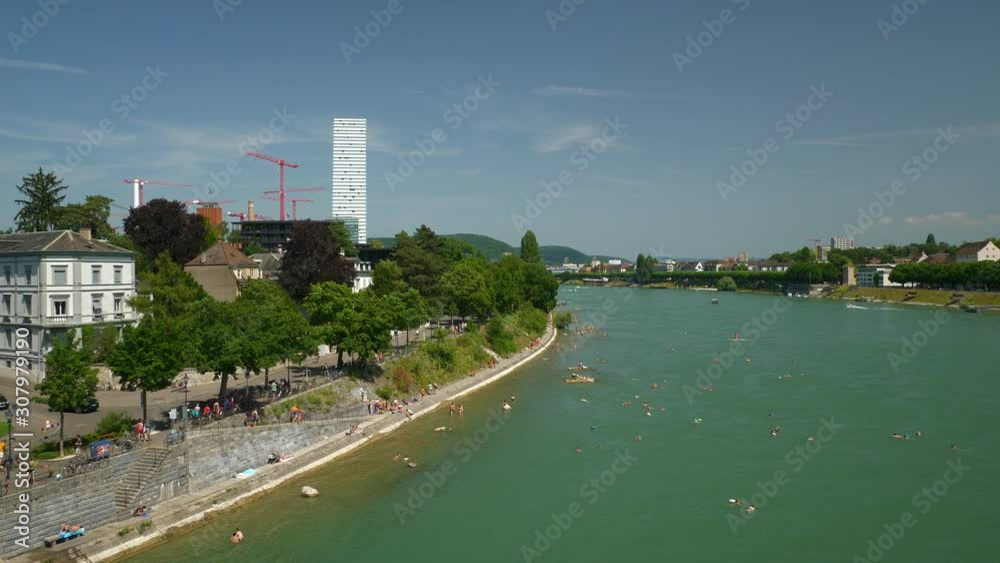 basel city sunny day river crowded swimming area bridge view panorama 4k switzerland basel city sunny day river crowded swimming area bridge view panorama 4k switzerland