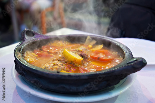 Tajine with stewed vegetables and fish. One of the types of Moroccan national cuisine.