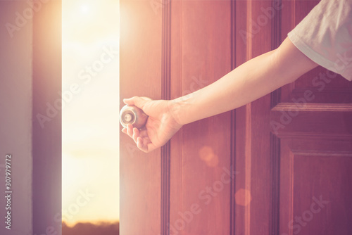 Women hand open door knob or opening the door,grand opening,Close up hand open door.