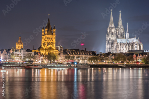 Evening scene over Cologne Koln city with Kolner Dom Cathedral behind the Hohenzollern bridge