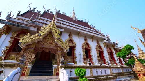 4K video of old pagoda with Buddhist church in Phra That Suthon Mongkhon Khiri temple, Thailand. photo