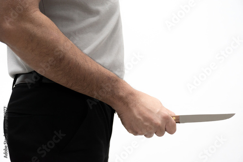 blackmail concept. A man with a knife behind his back on white background.