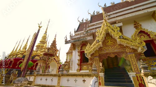 4K video of old pagoda with Buddhist church in Phra That Suthon Mongkhon Khiri temple, Thailand. photo