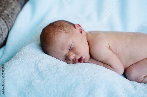 Portrait of sleeping Newborn baby at home