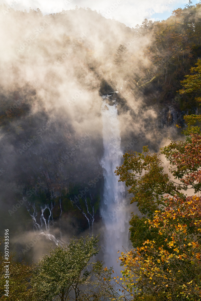wonderful view of kegon waterfall with fog and sun light in autumn nikko