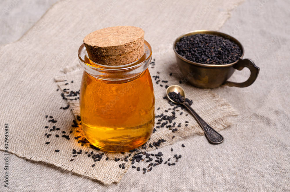 Glass jar with oil.