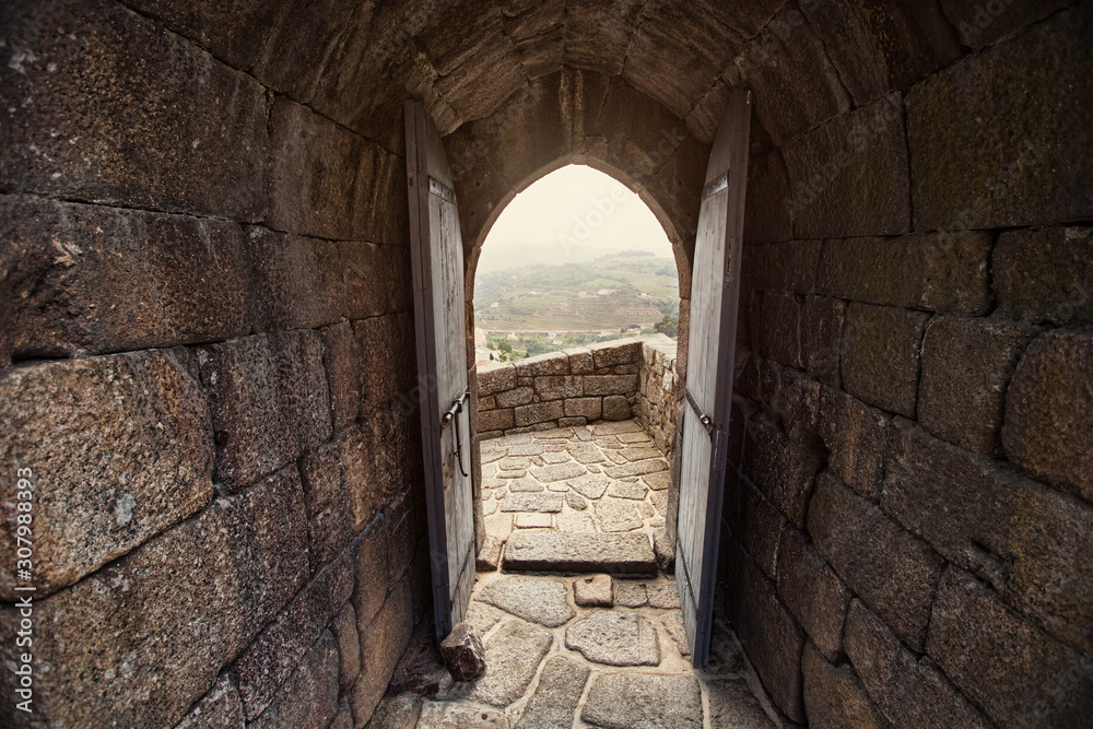 Open door old stone building in Europe