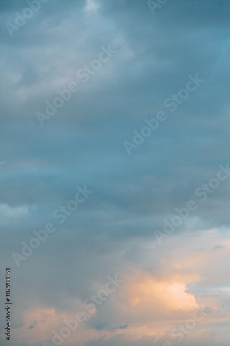 Fototapeta Naklejka Na Ścianę i Meble -  Uniform background for the screensaver. Blue gentle clouds at dawn.