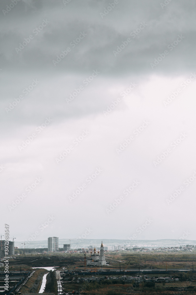 Screensaver and background for design. Morning panorama of the sky with the Church.