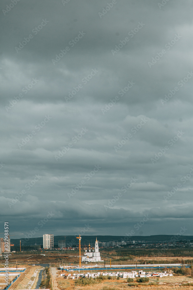 Screensaver and background for design. Morning panorama of the sky with the Church.