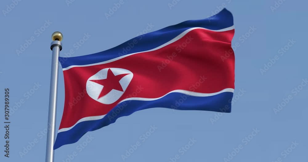 Flag of North Korea in front of a blue sky