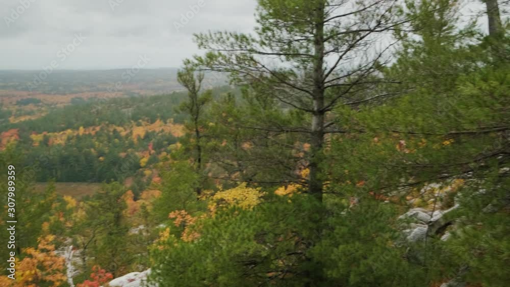 Man with Film Camera takes Photo at Lookout, Slow Motion Handheld Pan. Young male person with Vintage technology hiked to Stunning Landscape Panorama of fall leaf colors and outdoor nature wilderness Man with Film Camera takes Photo at Lookout, Slow Motion Handheld Pan. Young male person with Vintage technology hiked to Stunning Landscape Panorama of fall leaf colors and outdoor nature wilderness