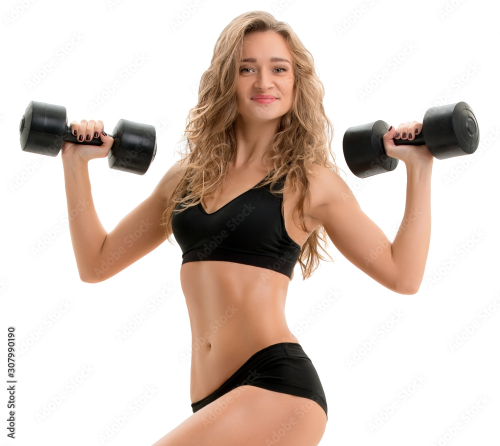 Curly athlete posing with dumbbells and stepper Curly athlete posing with dumbbells and stepper