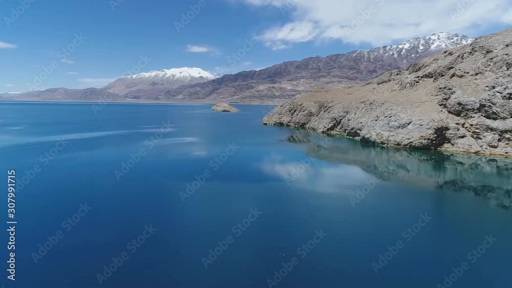 Ngari scenery in Tibet- Mountain Gurla Mandhata and Lake Manasarovar in the early morning the Ngari (Ali) , Tibet, China. (aerial photography) Ngari scenery in Tibet- Mountain Gurla Mandhata and Lake Manasarovar in the early morning the Ngari (Ali) , Tibet, China. (aerial photography)