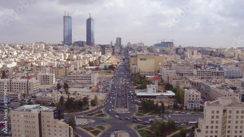 2019 - aerial over the city of Amman, Jordan downtown business district and traffic.