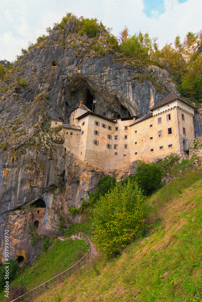Picturesque view of medieval Predjama castle (Slovene. Predjamski grad). Castle at the cave mouth. Popular travel destination in Slovenia