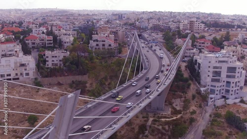 2019 - high aerial over the city of Amman, Jordan and Abdoun Bridge with vehicle traffic. photo