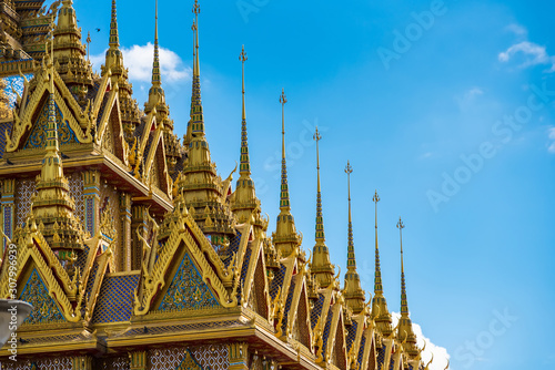 Uthai Thani  Thailand - November  30  2019   Golden pagoda against blue sky at Wat Tha Sung in Uthai Thani  Thailand.