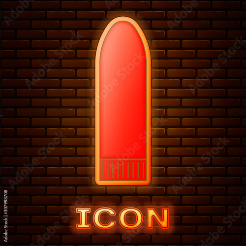 Glowing neon Dildo vibrator for sex games icon isolated on brick wall background. Sex toy for adult. Vaginal exercise machines for intimate.  Vector Illustration