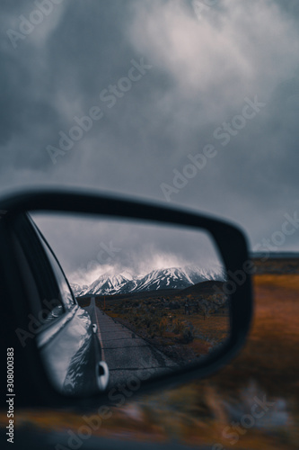 Car side mirror reflections © Pixelaro