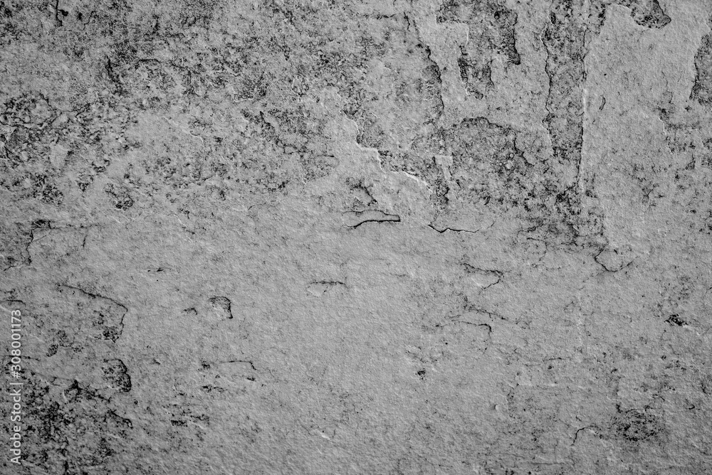 Fototapeta premium Texture of a concrete wall with cracks and scratches which can be used as a background