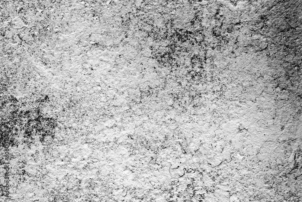 Fototapeta premium Texture of a concrete wall with cracks and scratches which can be used as a background